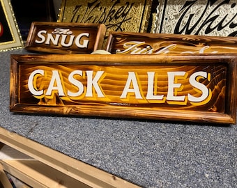 Cask ales  , traditionally hand lettered wooden pub/bar/mancave sign .