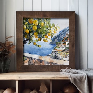 May include: A watercolor painting of a lemon tree with yellow lemons hanging from the branches. The tree is in the foreground of the painting, with a view of a coastal town and blue water in the background.