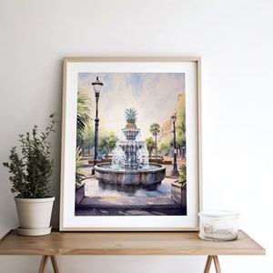 May include: A watercolor painting of a fountain with a pineapple on top, surrounded by palm trees and streetlights. The fountain is in a city square with buildings in the background.