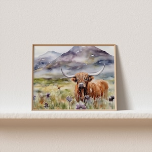 May include: Watercolor painting of a brown Highland cow standing in a field of purple wildflowers with a mountain range in the background.