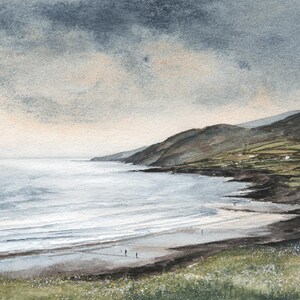 May include: Watercolor painting of a coastal landscape. The artwork depicts a beach with gentle waves, a dark shoreline, and green hills. The sky is overcast with shades of gray and beige, creating a serene and moody atmosphere.