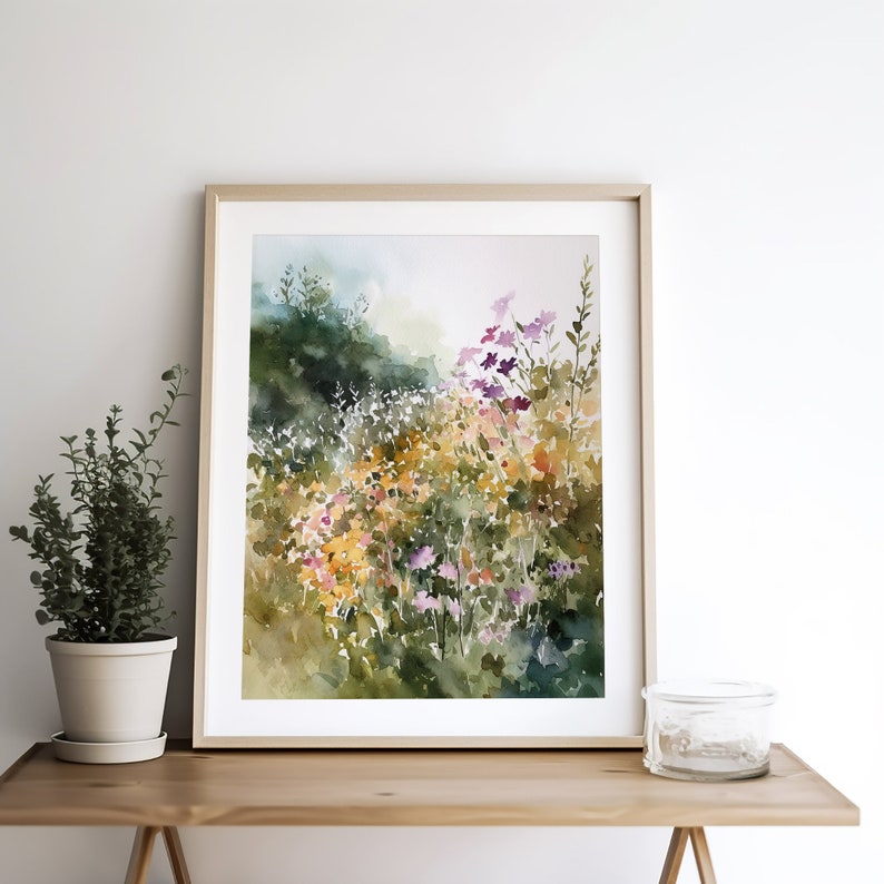 May include: A watercolor painting of a field of wildflowers in shades of pink, purple, yellow, and green. The flowers are arranged in a loose, organic pattern, and the background is a soft, hazy blue.