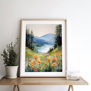 Puede incluir: Pintura acuarela de una escena de lago de monta&ntilde;a con un campo de amapolas naranjas en primer plano. El lago est&aacute; rodeado de &aacute;rboles y monta&ntilde;as en el fondo.