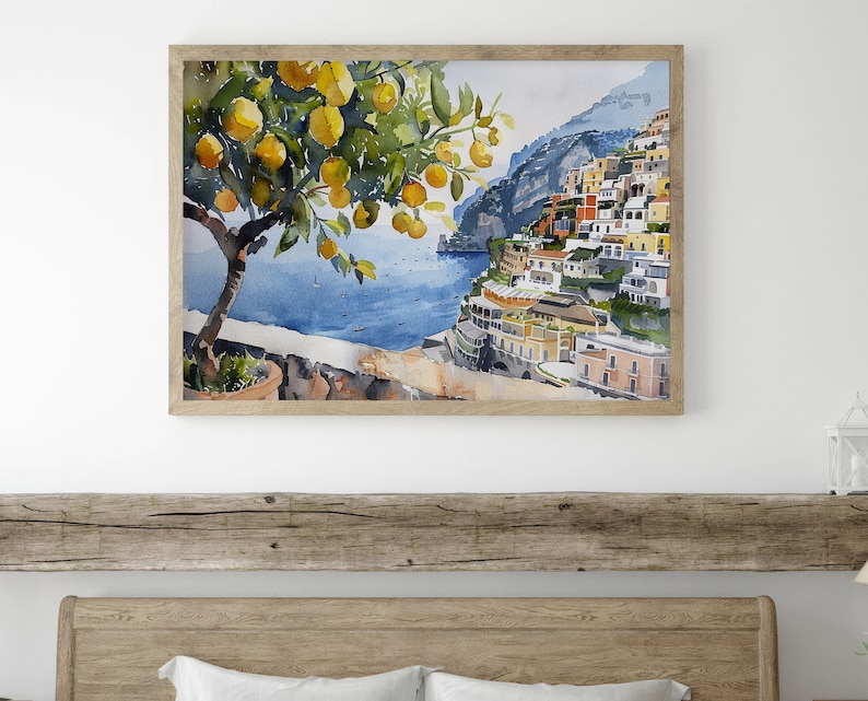 May include: Watercolor painting of a lemon tree with yellow lemons and green leaves in front of a colorful Italian village on a cliff overlooking the blue sea.