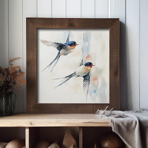 May include: A watercolor painting of two swallows in flight against a light blue and pink background. The swallows are depicted with detailed feathers and a realistic style.