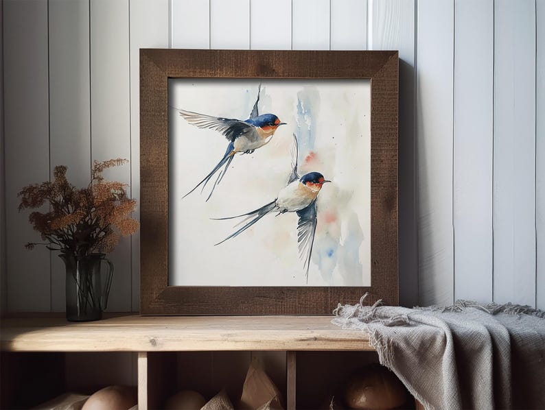 May include: A watercolor painting of two swallows in flight against a light blue and pink background. The swallows are depicted with detailed feathers and a realistic style.