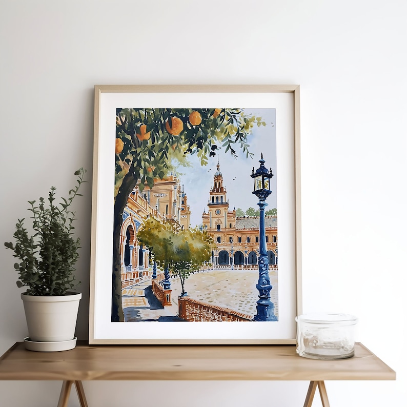 May include: Watercolour painting of a Spanish plaza with a tall building, orange trees, and a street lamp. The plaza is paved with cobblestones and there are buildings on all sides.