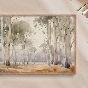 May include: A watercolour painting depicting a forest scene with tall, slender trees featuring white bark. The trees are set against a light grey background with a hint of blue. The painting has a soft, dreamy feel.