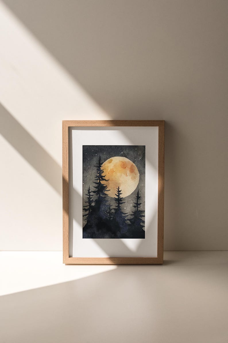 May include: Watercolor painting of a nighttime forest scene with a large, glowing moon. Silhouetted pine trees are in the foreground. The artwork is framed in a light brown wooden frame.