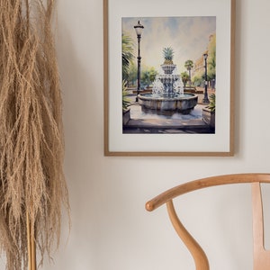 May include: Watercolor painting of a fountain with a pineapple on top, surrounded by trees and a street lamp. The fountain is in a square with a cobblestone path.