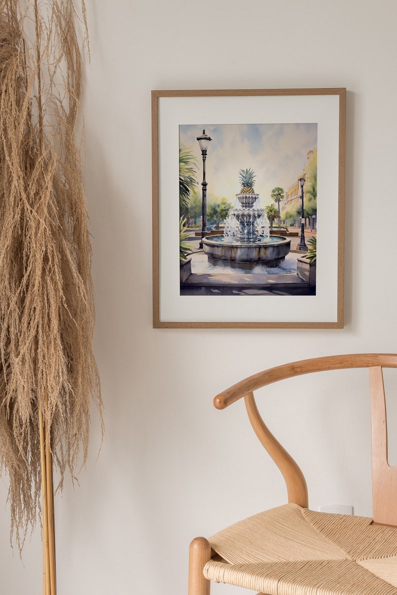 May include: Watercolor painting of a fountain with a pineapple on top, surrounded by trees and a street lamp. The fountain is in a square with a cobblestone path.