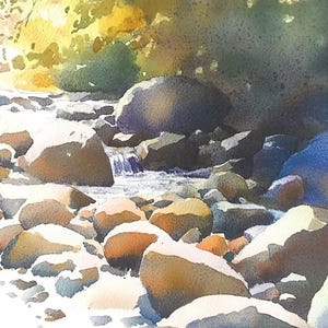 May include: A watercolor painting of a stream flowing over smooth, rounded rocks. The water is clear and the rocks are a variety of shades of brown, gray, and white. The background is a blur of green and blue, suggesting trees and sky.