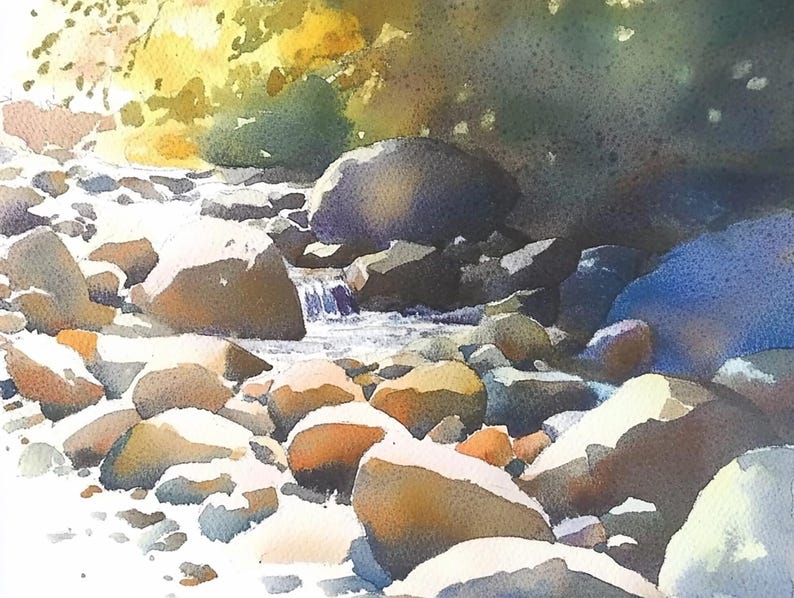May include: A watercolor painting of a stream flowing over smooth, rounded rocks. The water is clear and the rocks are a variety of shades of brown, gray, and white. The background is a blur of green and blue, suggesting trees and sky.
