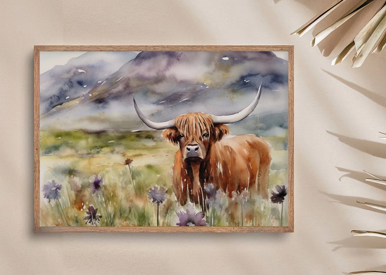 May include: Watercolor painting of a Highland cow standing in a field of wildflowers. The cow is brown with long, shaggy hair and large horns. The background is a misty mountain landscape.