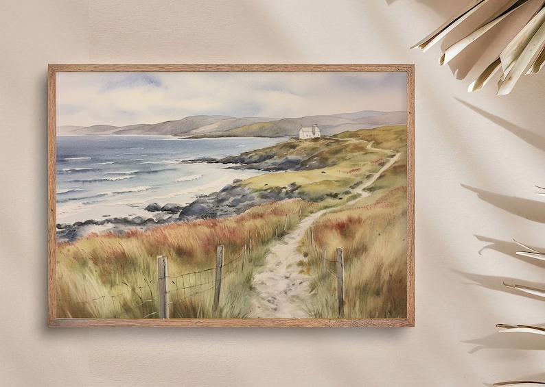 May include: A watercolour painting depicting a coastal scene with a white house perched on a hill overlooking a sandy beach and the ocean. A winding path leads to the house, surrounded by green grass and brown scrub.