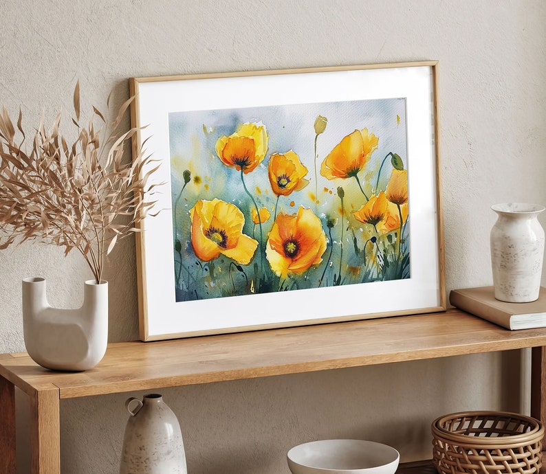 May include: A framed watercolor painting of yellow poppies with green stems and leaves on a light blue background.