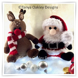 May include: Hand-knitted Christmas decorations: a reindeer with a red and white scarf and a Santa Claus figure. The reindeer is brown with a red nose, and Santa wears a red suit with a white beard and hat. Silver and white baubles are also present.