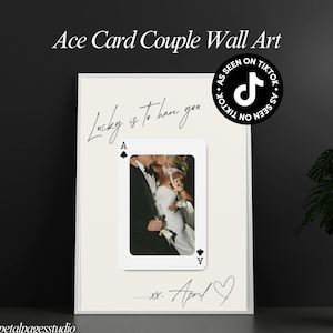 May include: Wall art featuring a photograph of a couple kissing, framed within a playing card design. The text "Lucky is to have you" is written above the card, with "xx. April" and a heart below. The words "Ace Card Couple Wall Art" are at the top.