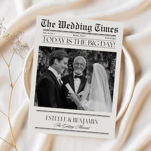 May include: A black and white wedding announcement newspaper clipping with the headline "The Wedding Times" and the text "Today is the Big Day!"  The announcement features a photo of a couple getting married with the text "Estelle & Benjamin Are Getting Married".