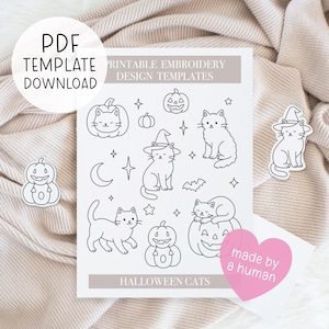 May include: A printable embroidery design template with Halloween-themed cats and pumpkins. The design includes various cat illustrations, some wearing witch hats, and jack-o'-lanterns. The text "PDF TEMPLATE DOWNLOAD" and "HALLOWEEN CATS" are visible.