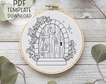 May include: Black and white line art illustration of a whimsical door with a crescent moon, ivy, and mushrooms. The door is arched and has a small keyhole. The illustration is perfect for embroidery or cross-stitch.