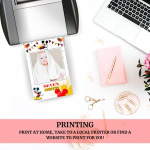 May include: Printable baby milestone card featuring Mickey Mouse and a baby in a white towel. The card says "Seven Months".