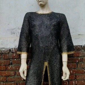 Medieval-style maille shirt with decorative brass edging