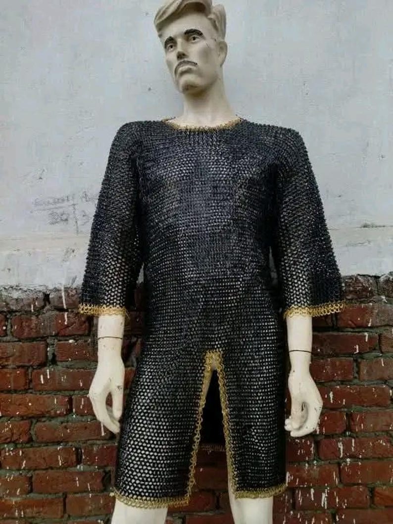 Medieval-style maille shirt with decorative brass edging