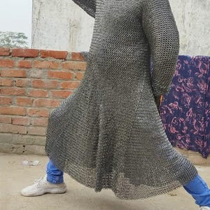 Steel ring mail hauberk laid out to show full coverage and craftsmanship