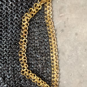 Heavy-duty Viking chainmail shirt with decorative brass edging