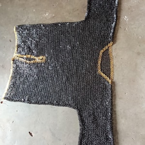 Authentic medieval Viking armor shirt made of 9mm steel rings and brass trim
