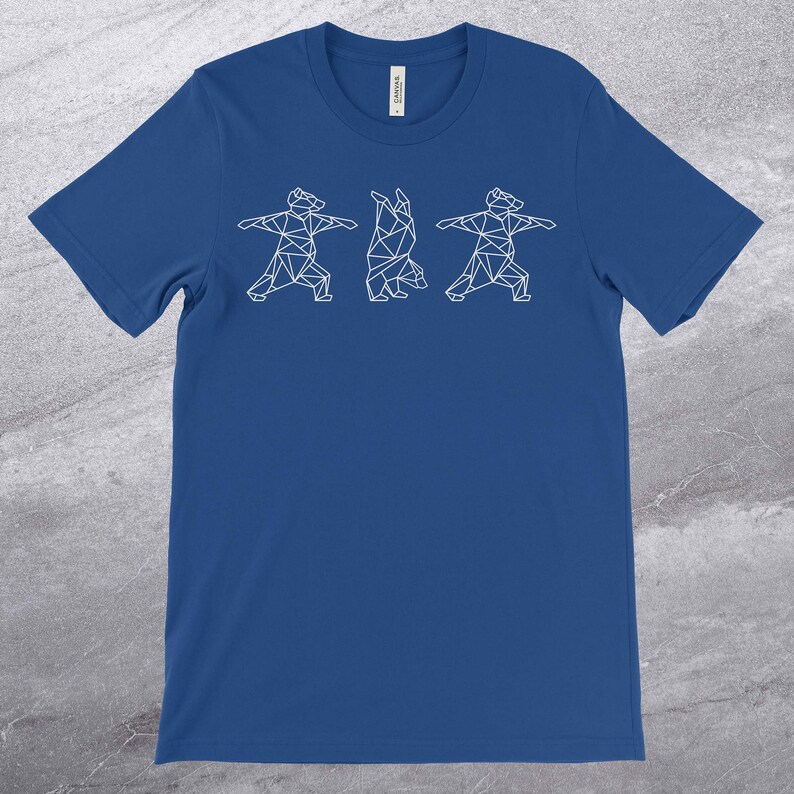 May include: A royal blue t-shirt with a white geometric design of three bears doing yoga poses.