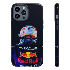 May include: A black phone case with a photo of a race car driver wearing a red bull racing helmet and a blue and red racing suit. The suit has the words "Oracle" and "Red Bull" on it. The helmet has the words "Schuberth" and "Never Give Up" on it.