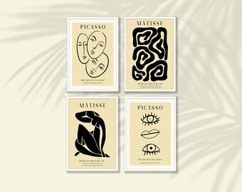 May include: Four framed art prints featuring Picasso and Matisse designs. The Picasso prints display line drawings of faces and facial features. The Matisse prints show abstract shapes and a figure. All prints have white frames.