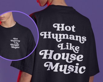 May include: Black t-shirt with the text "Hot Humans Like House Music" in white, displayed on the back. A smaller version of the text is on the front. The shirt is worn by a person with curly hair.