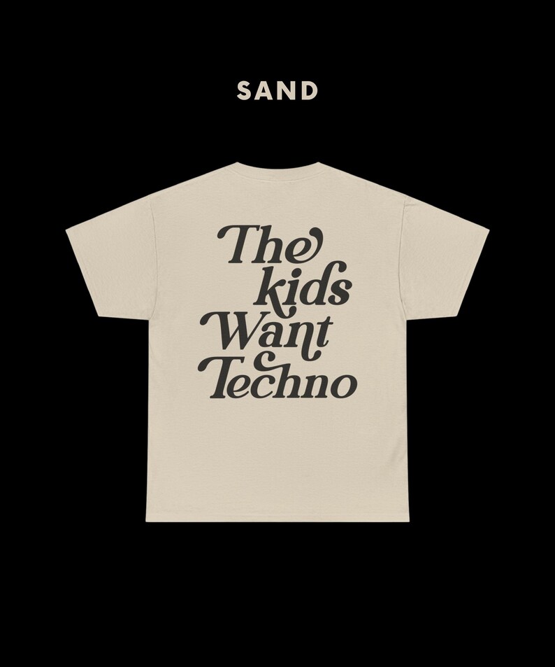 May include: A beige t-shirt with the text "The kids want Techno" printed in black on the back.