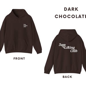 May include: A dark chocolate brown hoodie with a white logo that says "5am Lifting Club" on the front and back.
