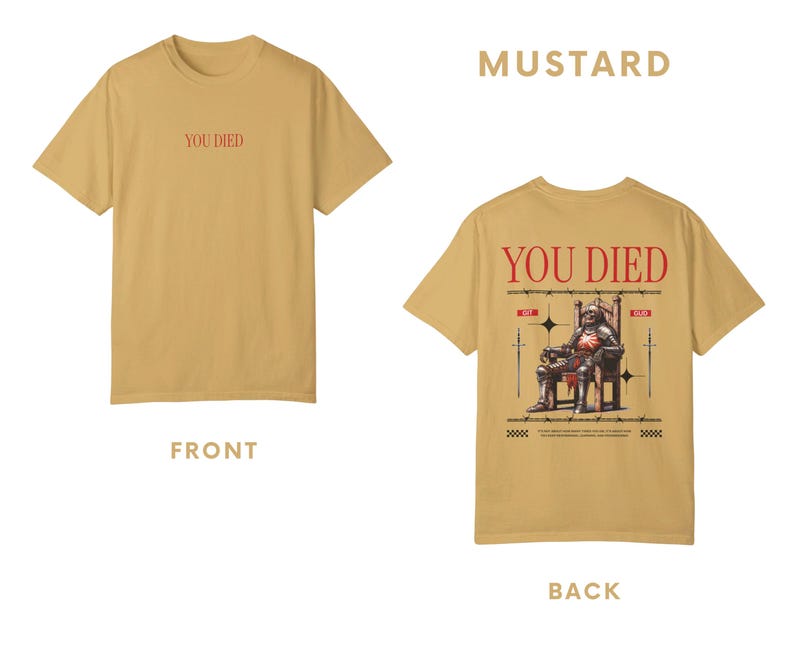 May include: A mustard yellow t-shirt with the text "You Died" printed on the front and a graphic of a knight sitting on a throne with the text "You Died" printed on the back.
