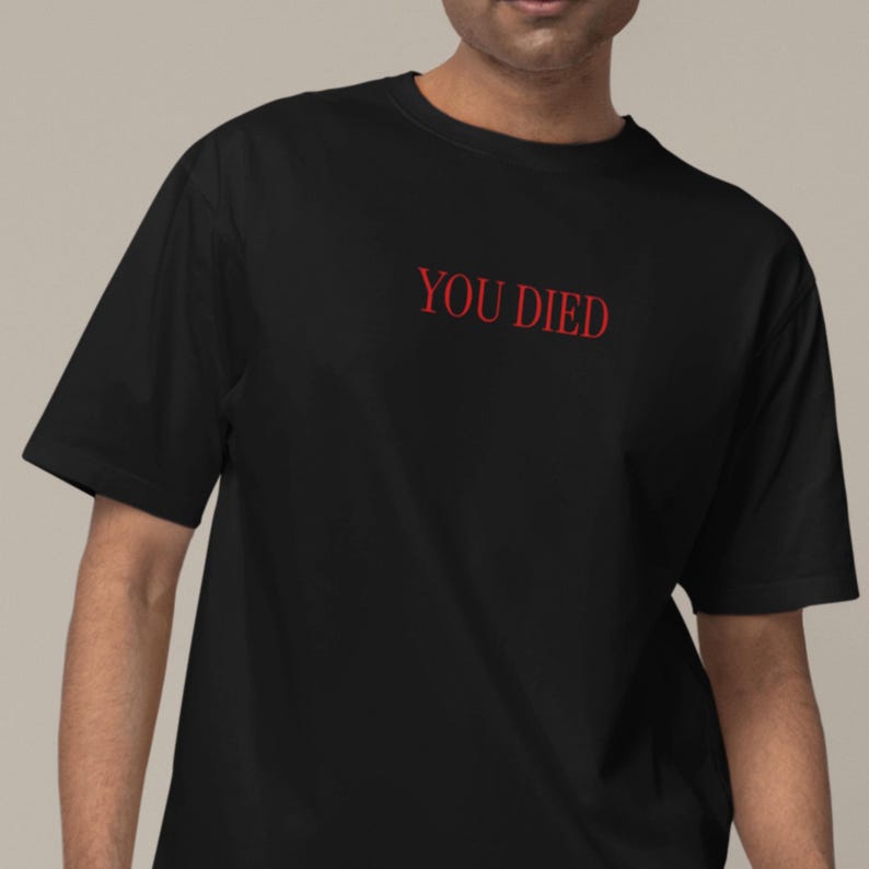 May include: Black t-shirt with the text "YOU DIED" in red.