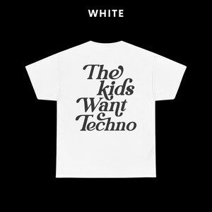 May include: White t-shirt with black text that reads "The kids want Techno".