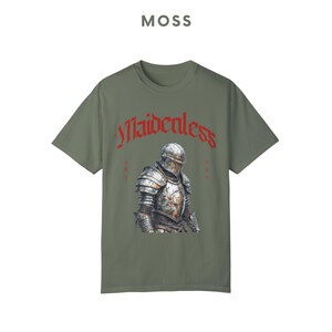 May include: A green t-shirt with a graphic of a knight in armor and the text "Maidenless" in red.