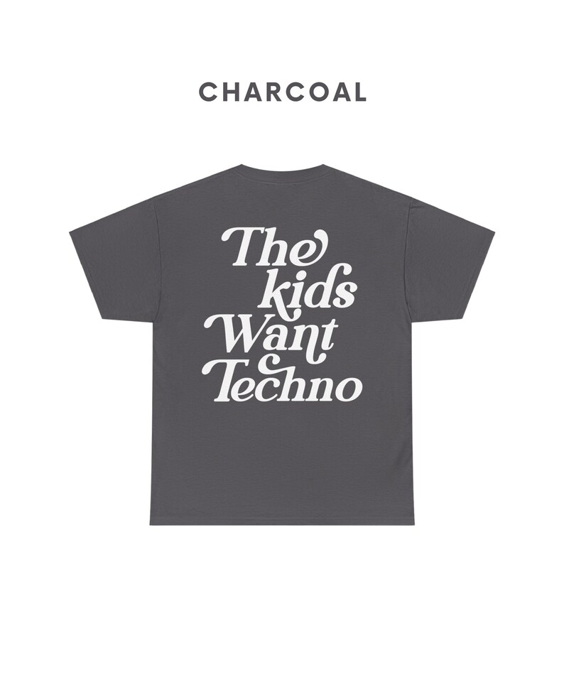 May include: A charcoal gray t-shirt with the text "The Kids Want Techno" printed in white.