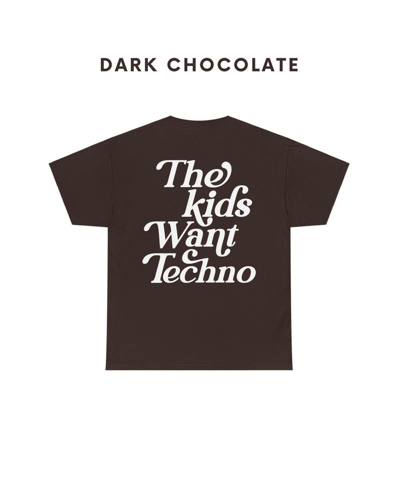 May include: Dark chocolate t-shirt with white text that reads "The kids want techno".