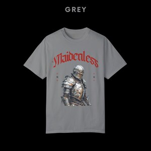 May include: Grey t-shirt with a knight in armor graphic and the text "Maidenless" in red.