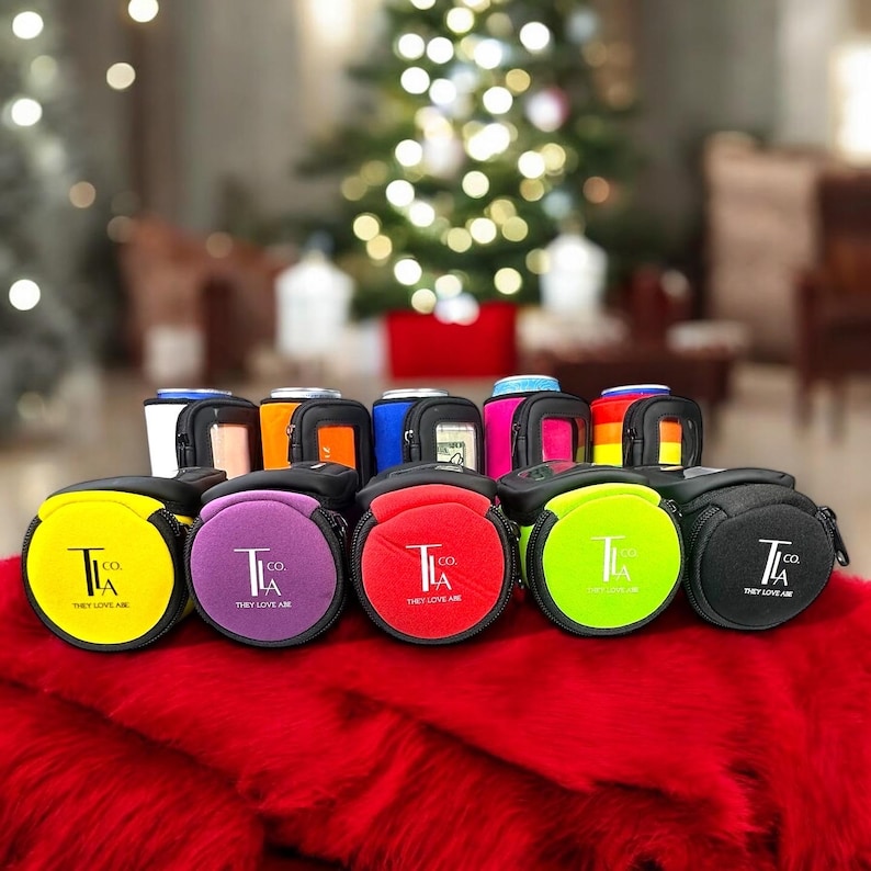 May include: A set of six colorful neoprene can coolers with a zipper closure. Each cooler features a black and white logo that reads "T.I. Co. They Love Air".