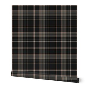 May include: A roll of wallpaper featuring a classic plaid pattern. The design incorporates a grid of intersecting lines in black, gray, and a muted pink. The wallpaper is rolled up, showcasing the pattern's repeat.