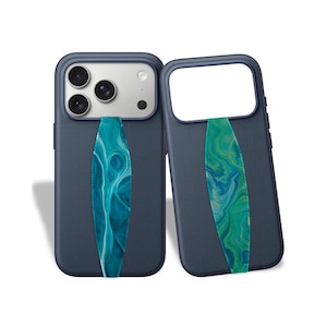 May include: Two navy blue phone cases with a teal and green marbled pattern hand strap. One case has a camera array, the other has an open camera space. The cases are designed to protect the phone and provide a secure grip.