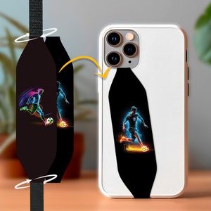 May include: A black phone case with a colorful graphic of a soccer player kicking a ball. The case is designed to fit a smartphone with a camera bump.