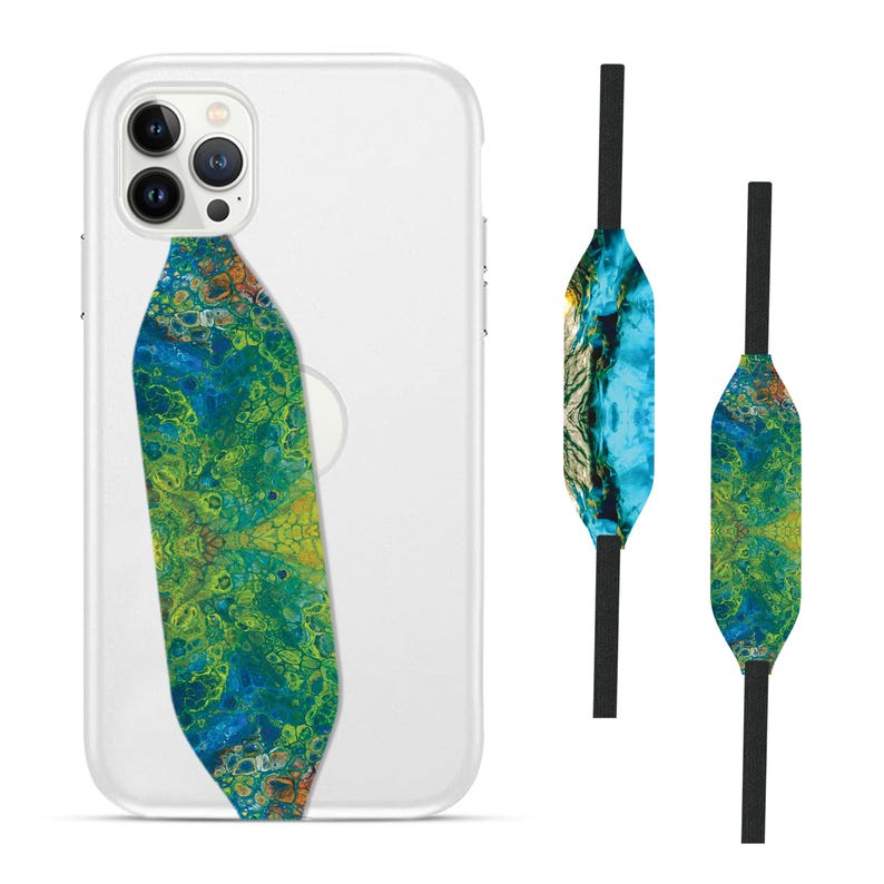 Switchbands reversible phone grip strap – Resin Tropical design. Features a vibrant 3D pattern with tropical elements like palm leaves and exotic flowers set in resin. Provides a secure, comfortable grip for your phone while adding a fresh, nature-inspired touch. The reversible design lets you change up your look effortlessly. Perfect for those who love vibrant, tropical vibes and want to add a colorful, lively touch to their phone.