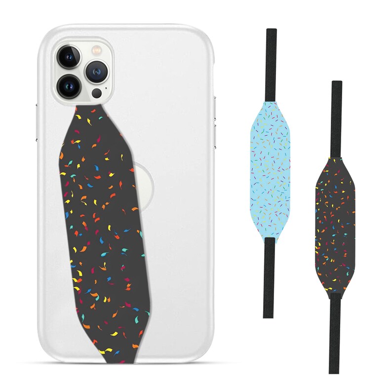 Switchbands reversible phone grip strap – Wacky Sprinkles design. Features a fun and playful 3D pattern with colorful, whimsical sprinkles scattered across the surface. Provides a secure, comfortable grip for your phone while adding a touch of joyful, lighthearted flair. The reversible design lets you easily switch up your style. Perfect for anyone who loves vibrant, fun designs and wants a unique, customizable phone accessory